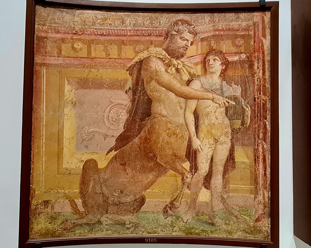 Herculaneum Augusteum. April 2023.
No.3 on above descriptive card, and below – Achilles and Chiron, inv. 9109.
On display in “Campania Romana” gallery in Naples Archaeological Museum. Photo courtesy of Giuseppe Ciaramella.