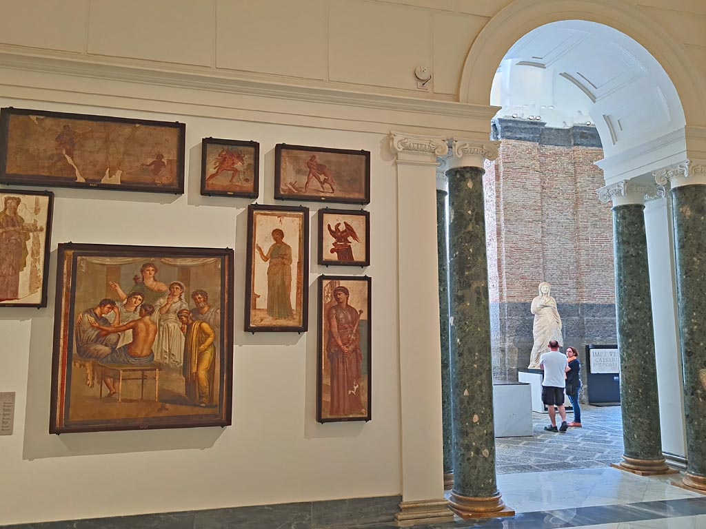 Herculaneum Augusteum. April 2023. Paintings on upper row – 9007, 9006 and 9011.
Paintings on middle row – 8903, 8962 and 8777.
Paintings on lower row – 9027 and 8976.
On display in “Campania Romana” gallery in Naples Archaeological Museum. Photo courtesy of Giuseppe Ciaramella.