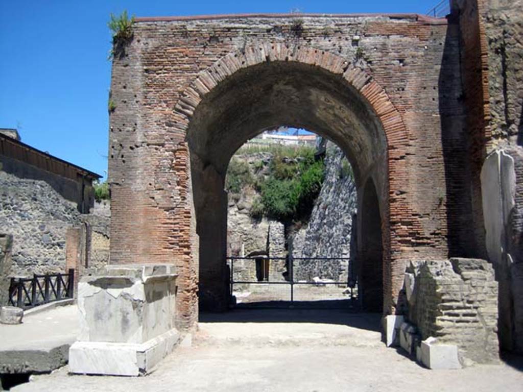 Herculaneum, June 2011. Looking west on Decumanus Maximus towards east side of the arch of the Augusteum/Basilica.
Photo courtesy of Sera Baker.