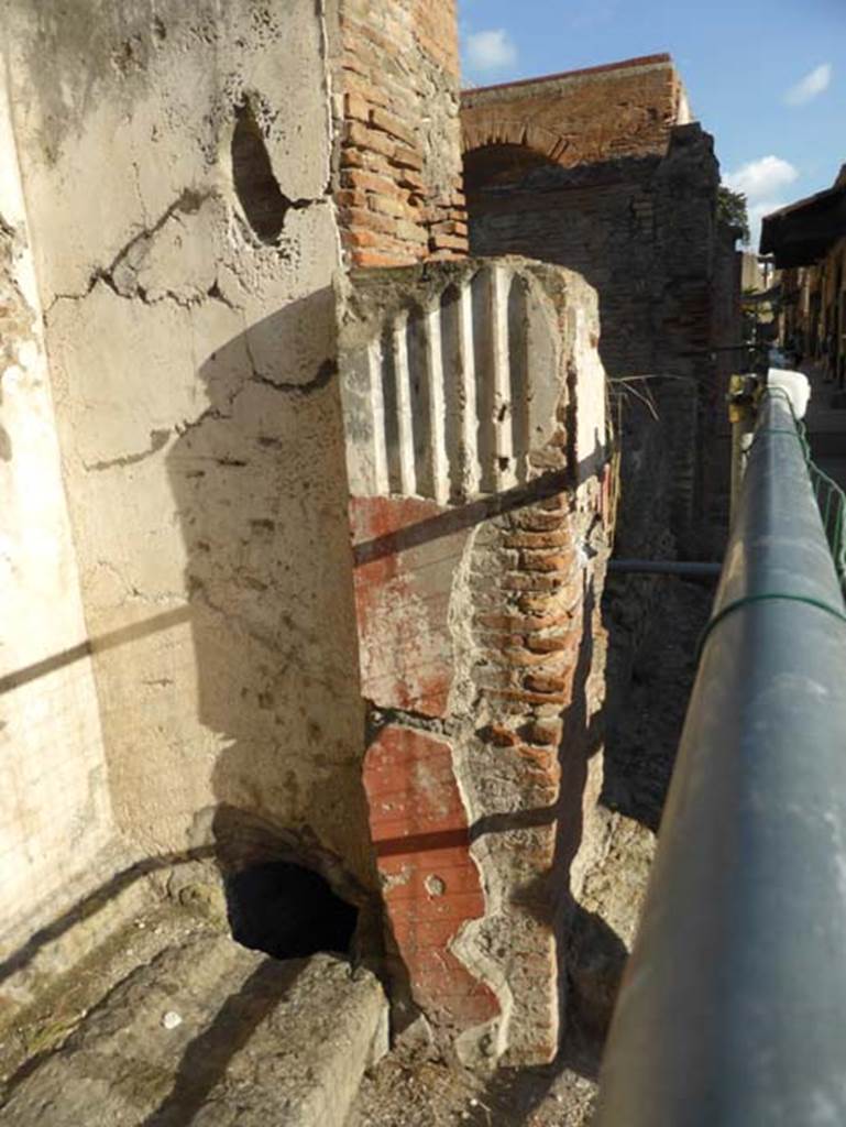 Herculaneum, September 2015. Looking east along front façade towards the four-sided Arch. The two four-sided Arches would have been joined by an arched portico.