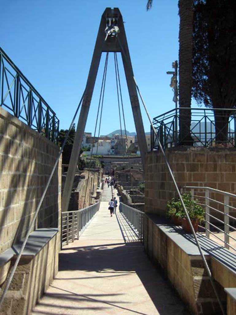Herculaneum, June 2011. Looking north across access bridge towards roadway known as Cardo III Inferiore.
Photo courtesy of Sera Baker.
