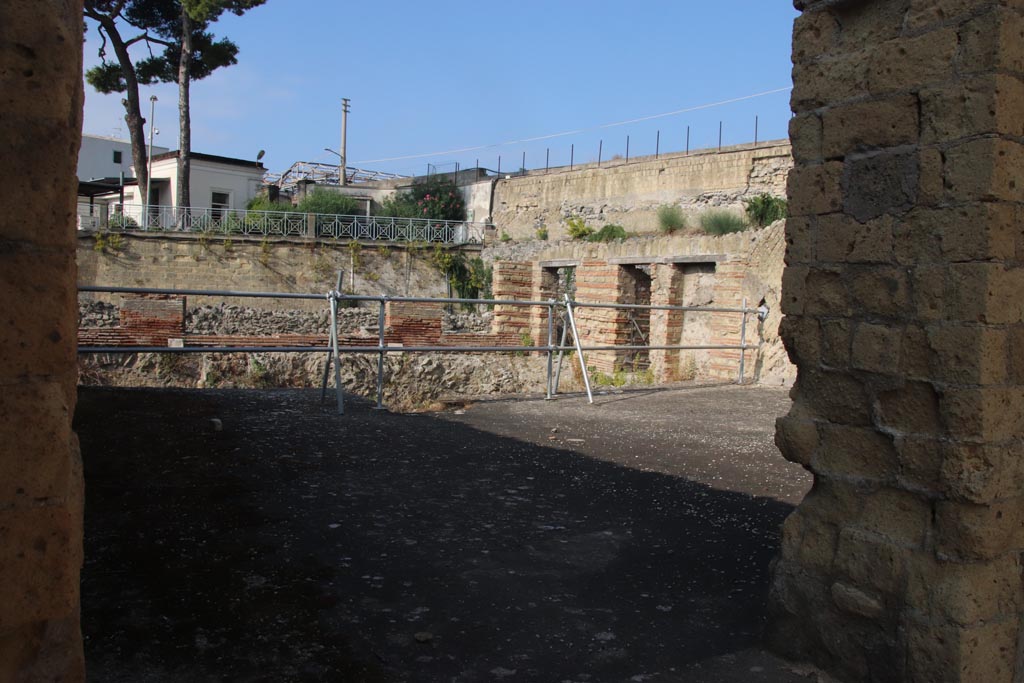 II.1 Herculaneum, October 2023. 
Looking south-west across room through doorway in south-west corner of atrium. Photo courtesy of Klaus Heese.
