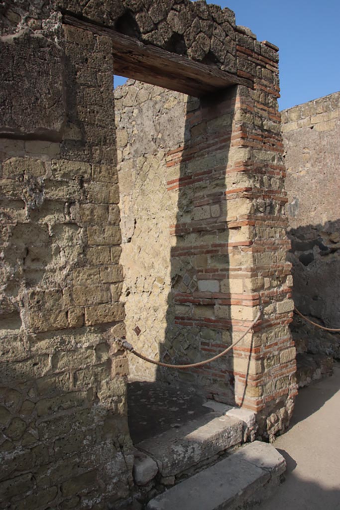 II.1 Herculaneum, October 2023. 
Doorway with steps in centre of south wall. Photo courtesy of Klaus Heese.

