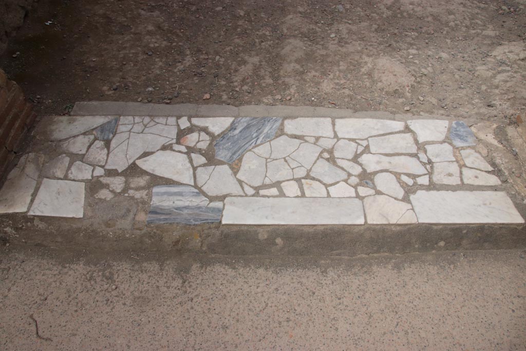II.2 Herculaneum, May 2024. 
Looking south across threshold from entrance room, leading to peristyle in north-east corner. Photo courtesy of Klaus Heese.
