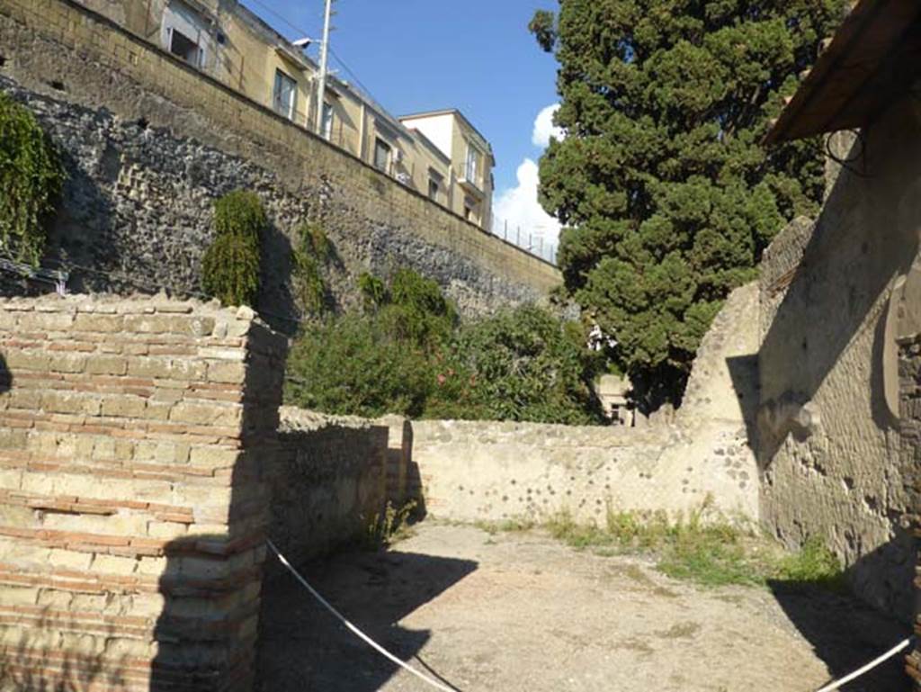 II.2 Herculaneum, September 2015. Looking towards remaining west and north wall of rectangular exedra. At the north end of the west wall was a doorway into a corridor/room.  According to Pesando and Guidobaldi, the flooring which was of polychrome marble was carried away by the Bourbon excavators.

