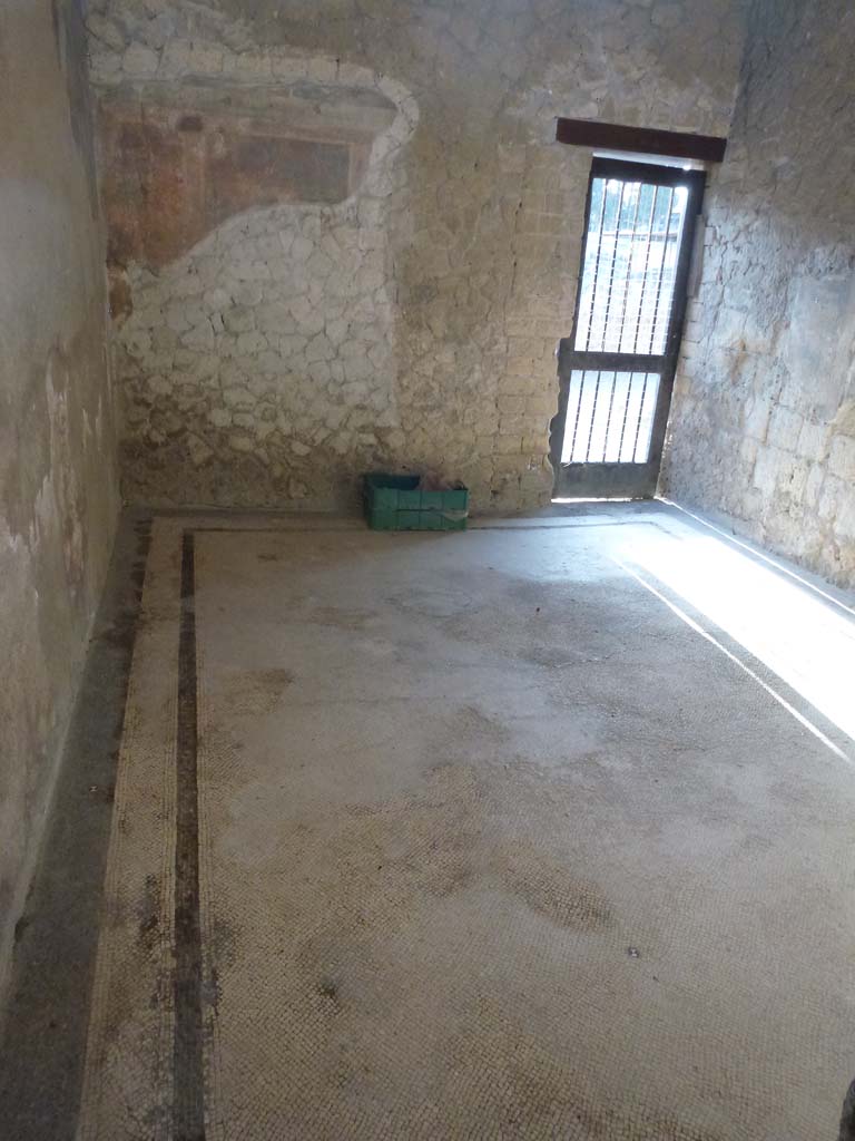 III.19/18/1, Herculaneum. October 2012. 
Room 3, looking south across apodyterium or waiting room, from corridor. Photo courtesy of Michael Binns.
