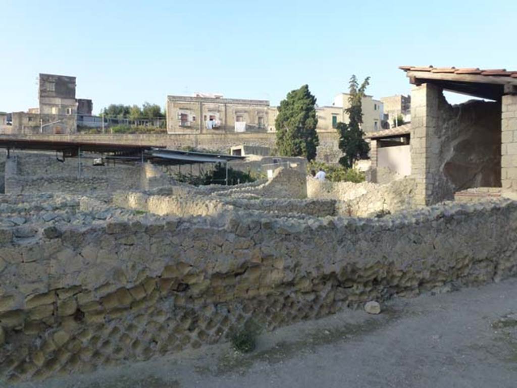 III, 19/18/1, Herculaneum. October 2012. Looking north-west from Cardo IV Inferiore, across rooms on south side of atrium. Photo courtesy of Michael Binns.
