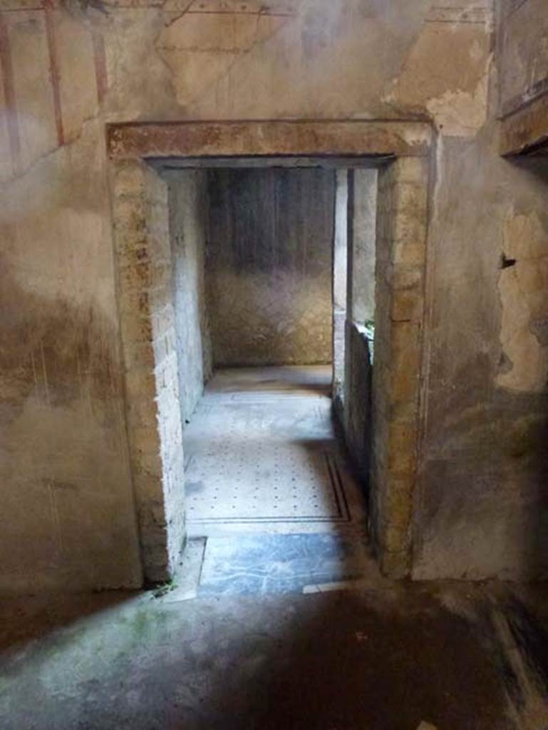 IV.4 Herculaneum. October 2012. Room 23, south wall of anteroom, with doorway to east end of corridor 21.  Photo courtesy of Michael Binns.
