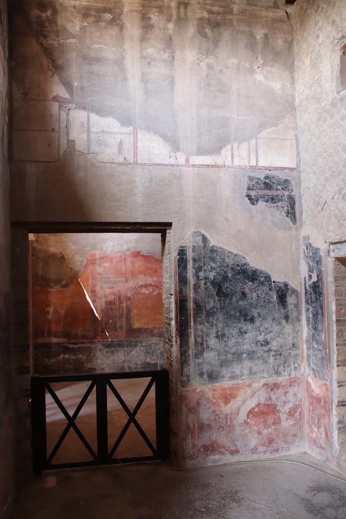 IV.21, Herculaneum. September 2019. 
Room 6, antechamber, looking west to doorway to Oecus 7, on left.
The doorway to Room 8 is in the north wall, on the right. Photo courtesy of Klaus Heese.
