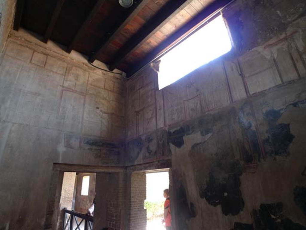 IV.21, Herculaneum, June 2017.  Room 6, looking south-east towards doorway to triclinium 5, centre left, and doorway to cryptoporticus 28, centre right.  Corridor 27, leading north to kitchen area, would be on the left. Photo courtesy of Michael Binns.

