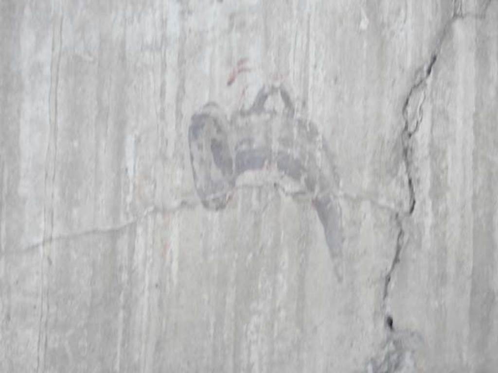 IV.21, Herculaneum. May 2018. Room 6, detail of painted decoration from upper centre of south wall.
Photo courtesy of Buzz Ferebee. 
