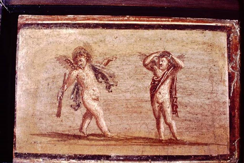 IV.21, Herculaneum. 1968. Small painting of cupids, found 7th September 1748.  Photo by Stanley A. Jashemski.
Source: The Wilhelmina and Stanley A. Jashemski archive in the University of Maryland Library, Special Collections (See collection page) and made available under the Creative Commons Attribution-Non-Commercial License v.4. See Licence and use details.
J68f0815 
Now in Naples Archaeological Museum. Inventory number 9176.
See Antichità di Ercolano: Tomo Primo: Le Pitture 1, 1757, Tav. XXX, p.157.