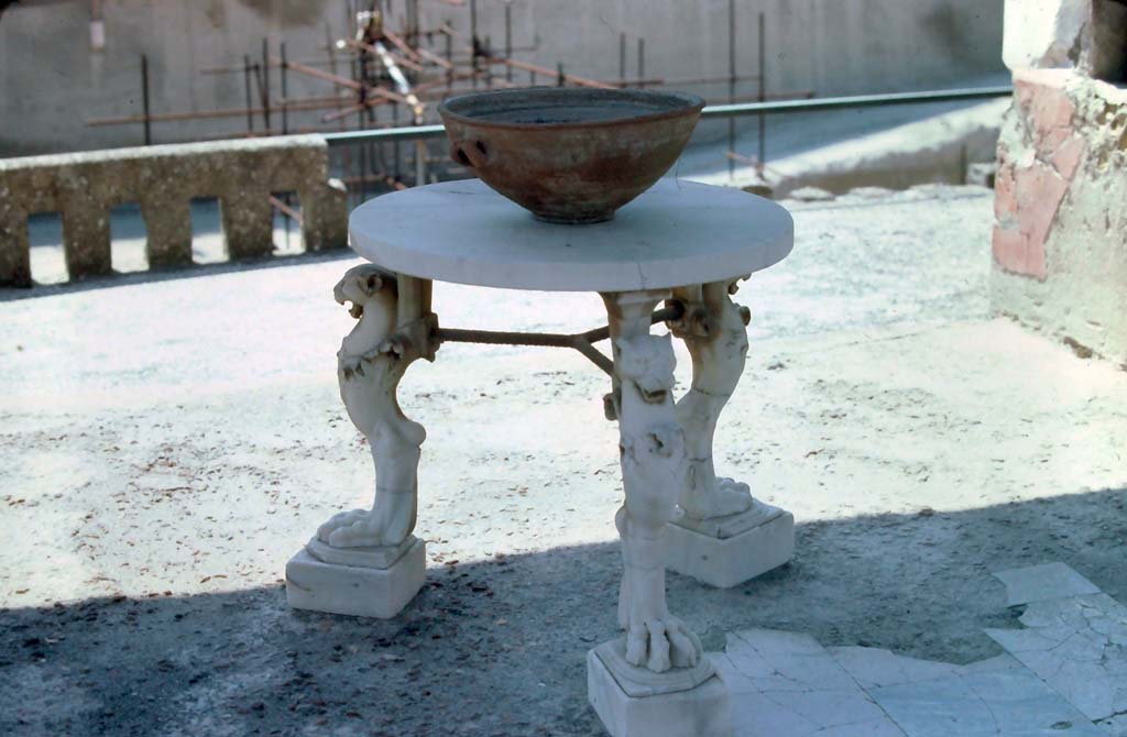 IV.21, Herculaneum. 7th August 1976. Pergola 18, looking south to table, and terrace overlooking beachfront. 
Photo courtesy of Rick Bauer, from Dr George Fay’s slides collection.
