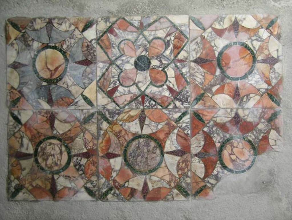 IV.21 Herculaneum. May 2005. Diaeta 23 on west side of terrace. Complex opus sectile flooring. 
Photo courtesy of Nicolas Monteix.
See Tinh, Tran Tam, 1988. La Casa dei Cervi a Herculanum. Roma: Giorgio Bretschneider, fig. 24.
See Sposito, Francesca, 2016. TESS – scheda 18421 (http://tess.beniculturali.unipd.it/web/scheda/?recid=18421), 