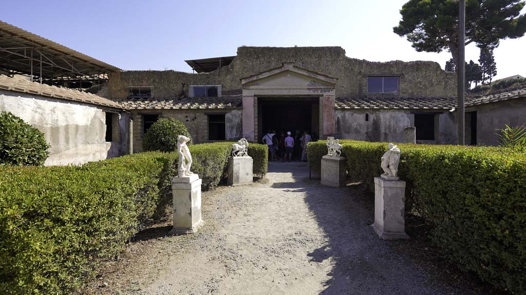 IV.21, Herculaneum. August 2021. 
Garden area 32, looking north to central doorway into Cryptoporticus 28. Photo courtesy of Robert Hanson.
