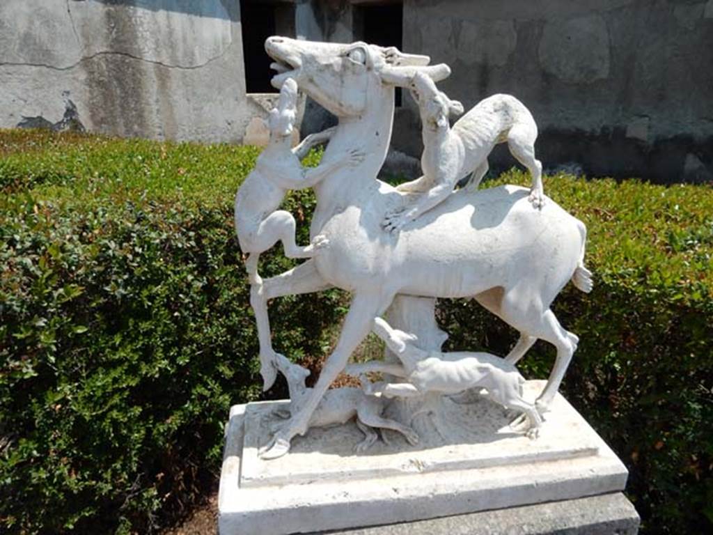 IV.21, Herculaneum. May 2018. Garden 32, one of two statues of deer being attacked by hounds
Photo courtesy of Buzz Ferebee. 
