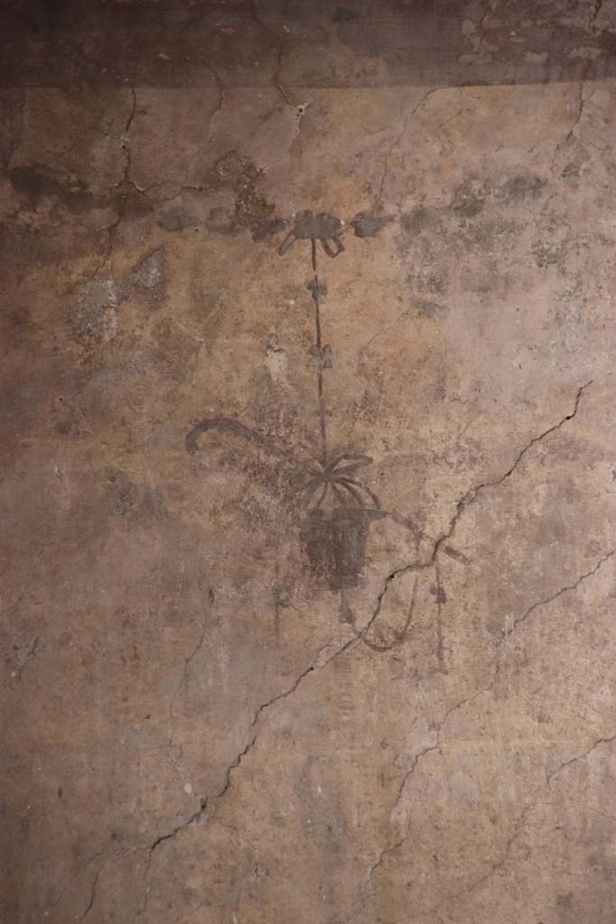 IV.21, Herculaneum. October 2020.  
Room 24, detail of painted decorations, below Sphynx, from south end of upper west wall of atrium.
Photo courtesy of Klaus Heese. 
