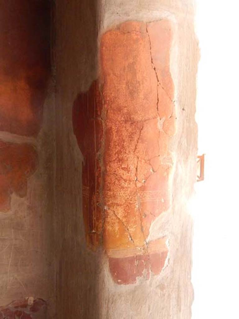 V.1 Herculaneum. May 2018. Room 4, painted decoration on east side of doorway. 
Photo courtesy of Buzz Ferebee.

