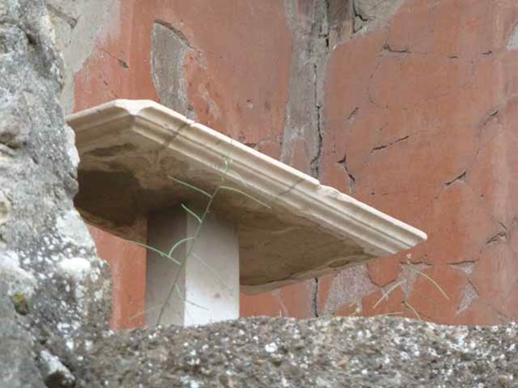 V.7/6, Herculaneum. May 2010. Upper room b, looking towards table against north wall. 
