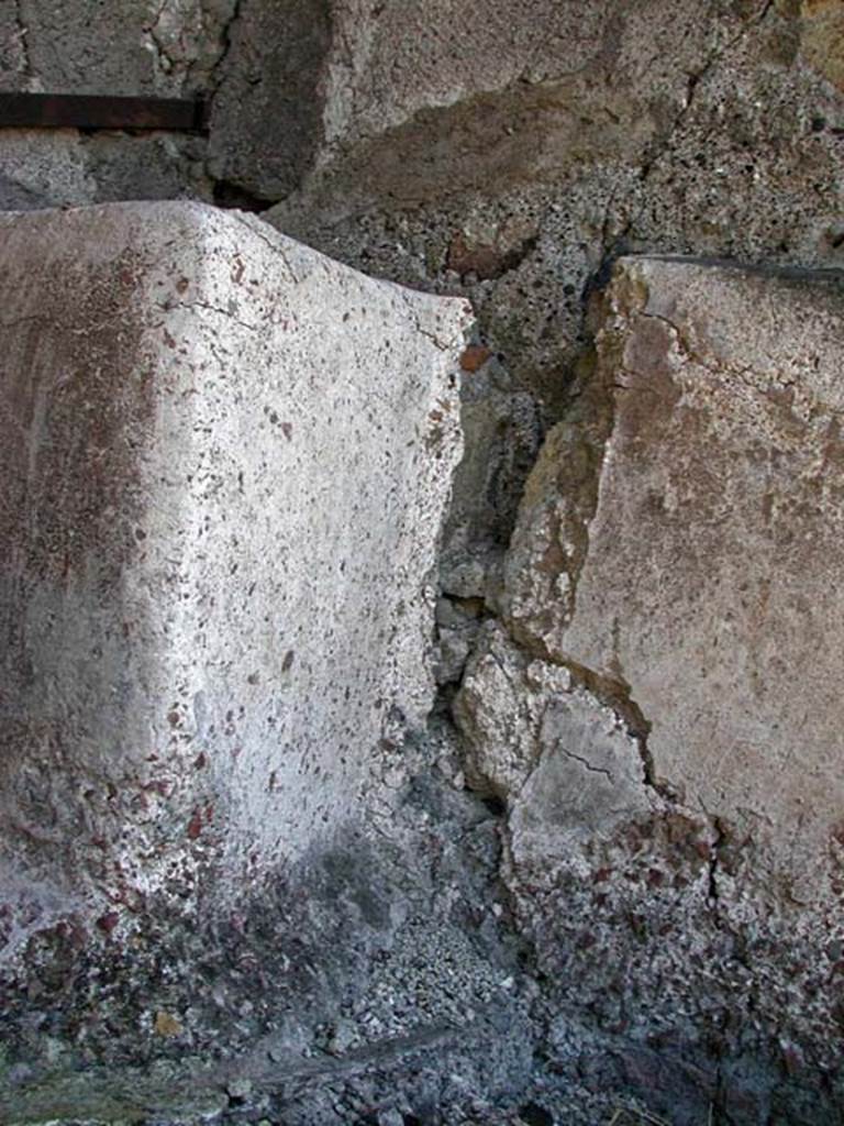 A stone wall

Description generated with very high confidence