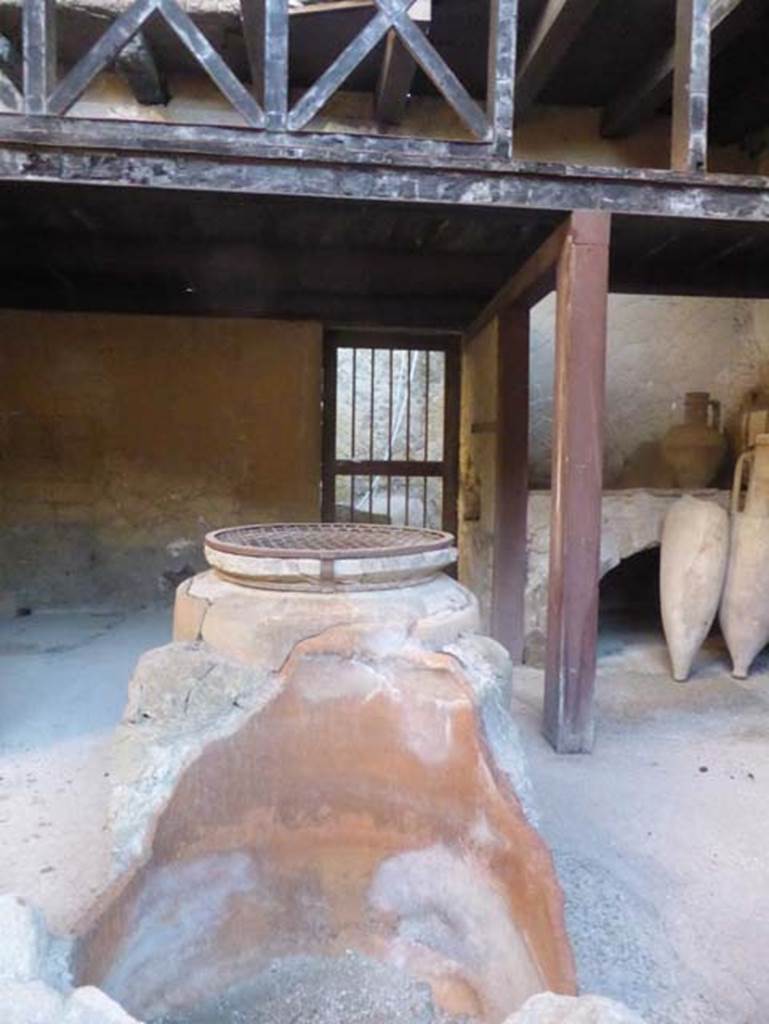 Ins. V 6, Herculaneum, September 2015. Looking across wine-shop to doorway to rear room in east wall.