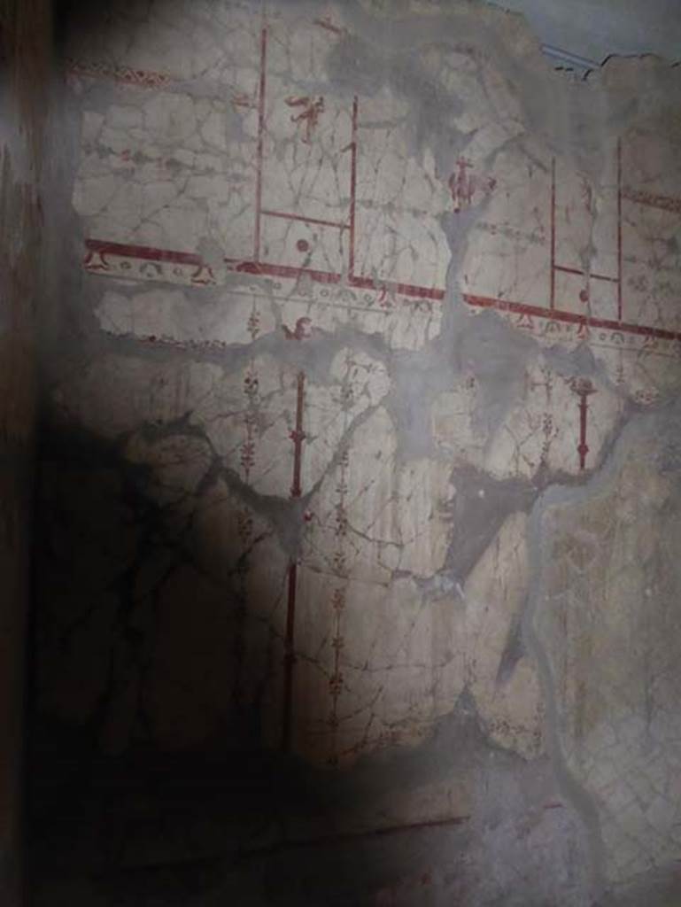 V.8, Herculaneum. October 2014. Painted wall decoration from room on west of corridor.  Photo courtesy of Michael Binns.
