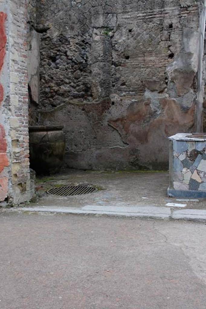 V.10, Herculaneum, April 2010. Looking towards south-east corner. 
On the rear, south wall, are holes for shelf-supports. Photo courtesy of Nicolas Monteix.
