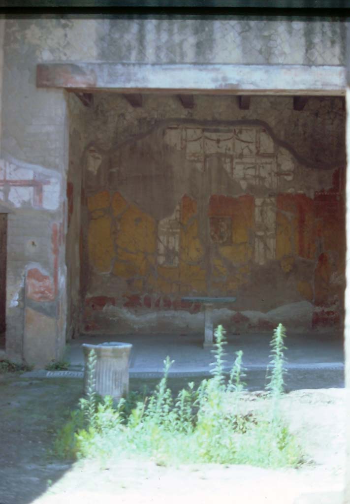 V.11 Herculaneum. 7th August 1976. Looking south across atrium towards tablinum.
Photo courtesy of Rick Bauer, from Dr George Fays slides collection.

