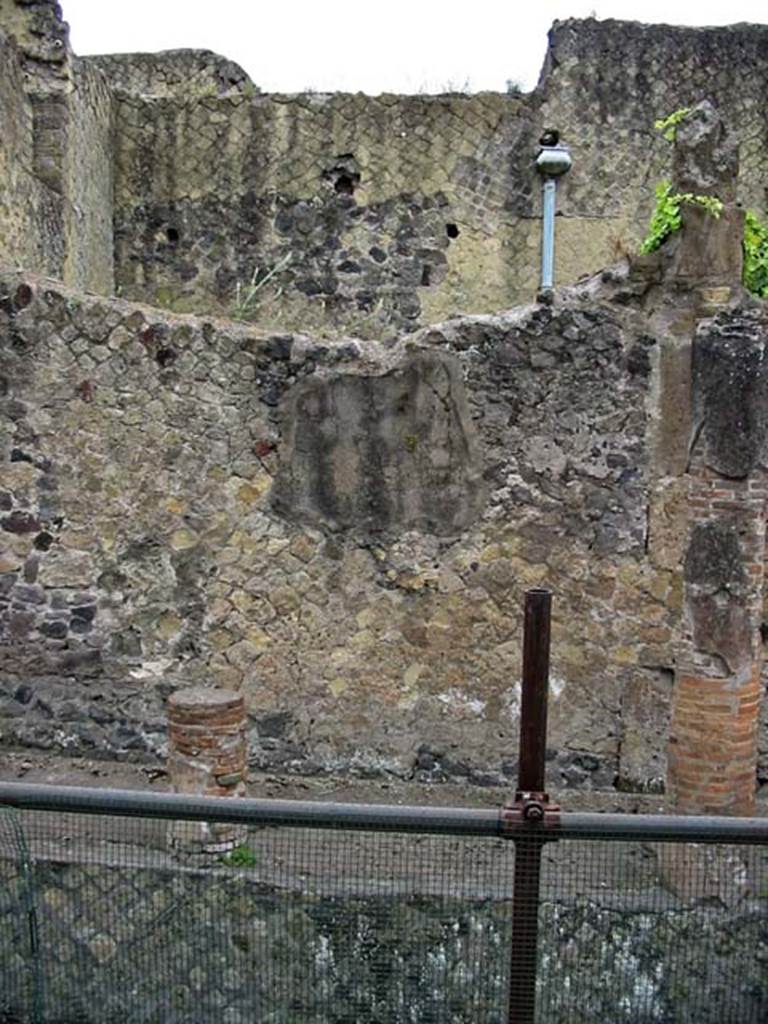 V.11, Herculaneum. May 2003. West exterior wall which would have been under a portico on Cardo IV. 
Photo courtesy of Nicolas Monteix
Behind the wall would be the area of the large rear room on west side of tablinum.
