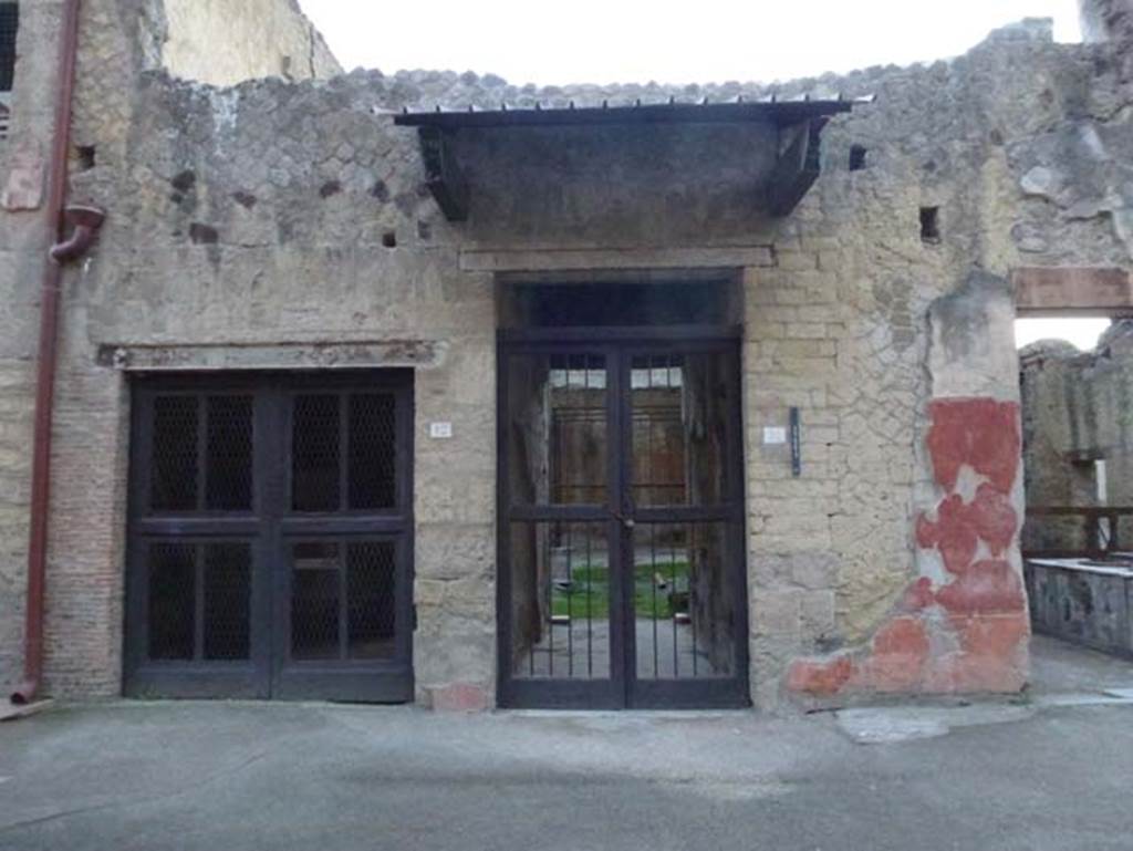 V 12 doorway on left, V.11, House of Apollo the Lyre-Player, in centre, and V.10, on right. October 2012.  Looking south to entrance doorways.  Photo courtesy of Michael Binns.
