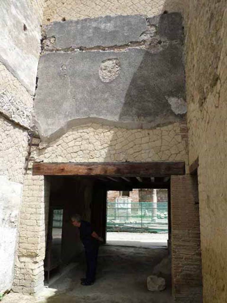 Ins. V, 19. May 2010. Looking north towards the shop-room. In the east wall, on the right, is a doorway linking to V.20.
