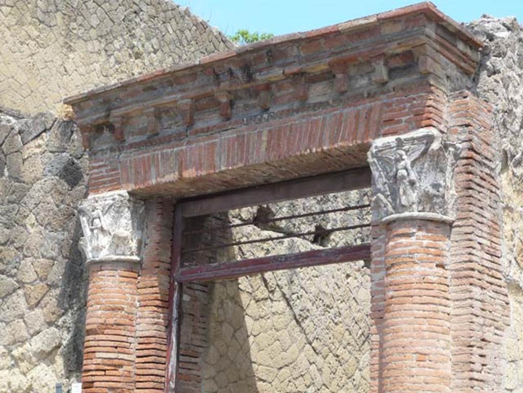 V,35 Herculaneum. August 2013. Entrance doorway surround. Photo courtesy of Buzz Ferebee.