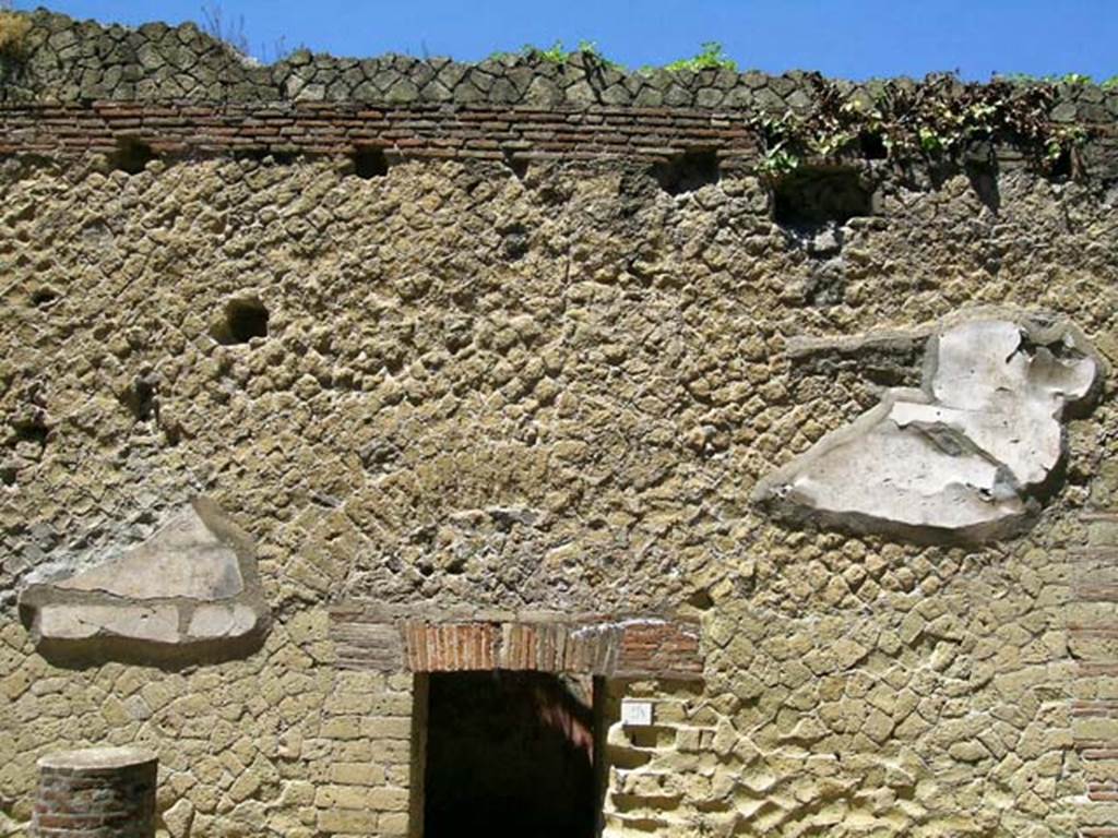 VI.9, Herculaneum. May 2005. Upper facade above entrance doorway. Photo courtesy of Nicolas Monteix.


