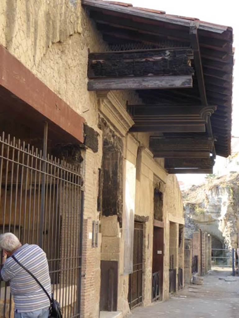 VI.12 Herculaneum, on left. September 2015. Looking west along north side of insula VI, on Decumanus Maximus.  Photo courtesy of Michael Binns.
