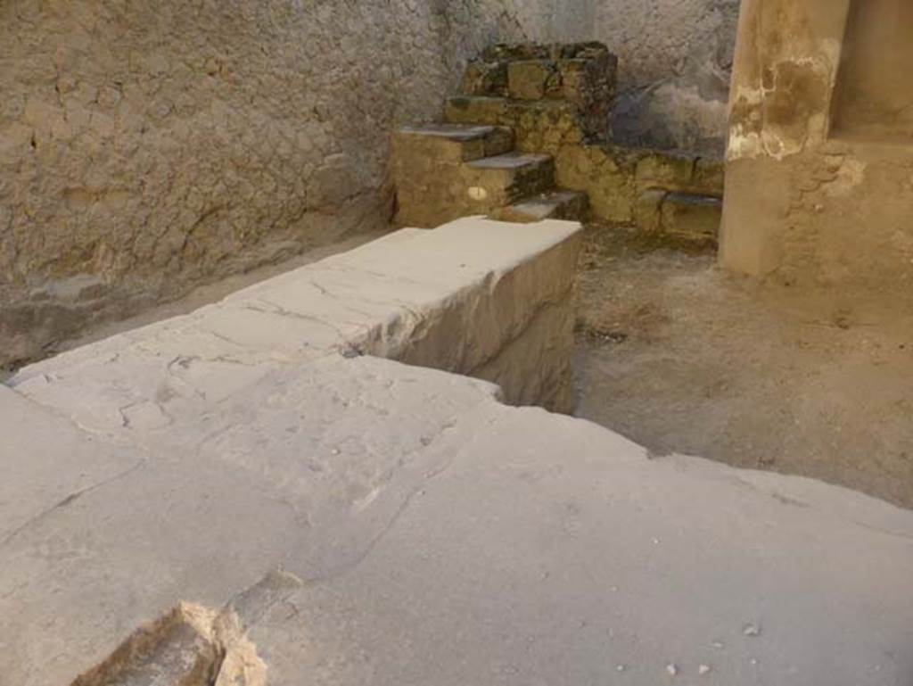 VI.12 Herculaneum, September 2015. Looking towards east wall and south-east across counter towards rear-room.