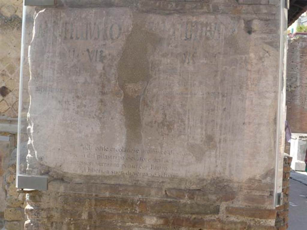 VI 12, Herculaneum, August 2013. Graffiti on north-east corner of Insula VI, adjacent to the shop at VI.12. Looking west. Photo courtesy of Buzz Ferebee.  
