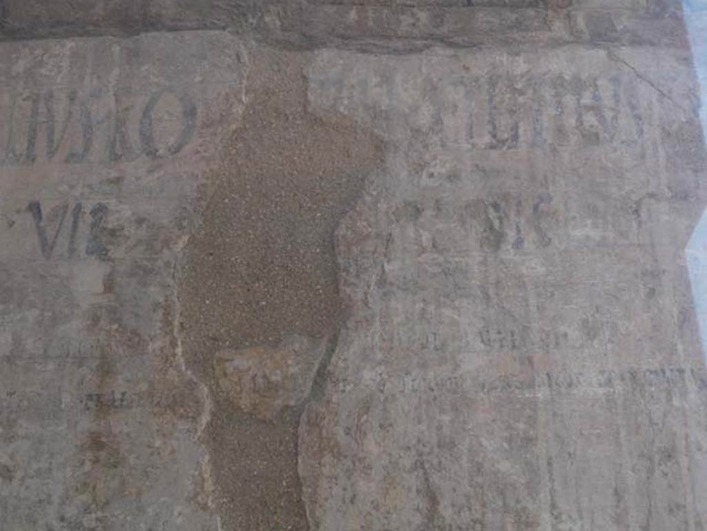 VI 12, Herculaneum, August 2013. Detail of graffiti on north-east corner of Insula VI, adjacent to the shop at VI.12.  Photo courtesy of Buzz Ferebee.  
