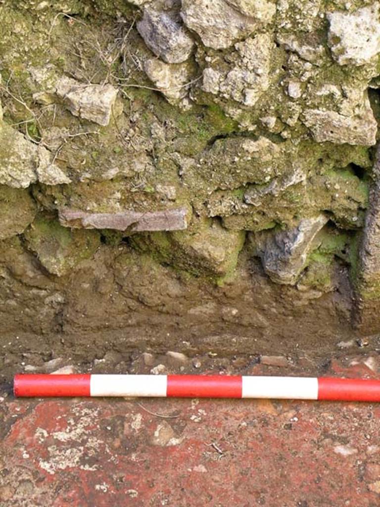 VI.25, Herculaneum. May 2004. Rear room, blocked doorway in west wall. 
Photo courtesy of Nicolas Monteix.
