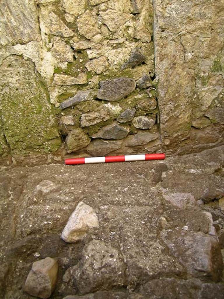 VI.25, Herculaneum. May 2004. Rear room, flooring near blocked window in west wall. 
Photo courtesy of Nicolas Monteix.
