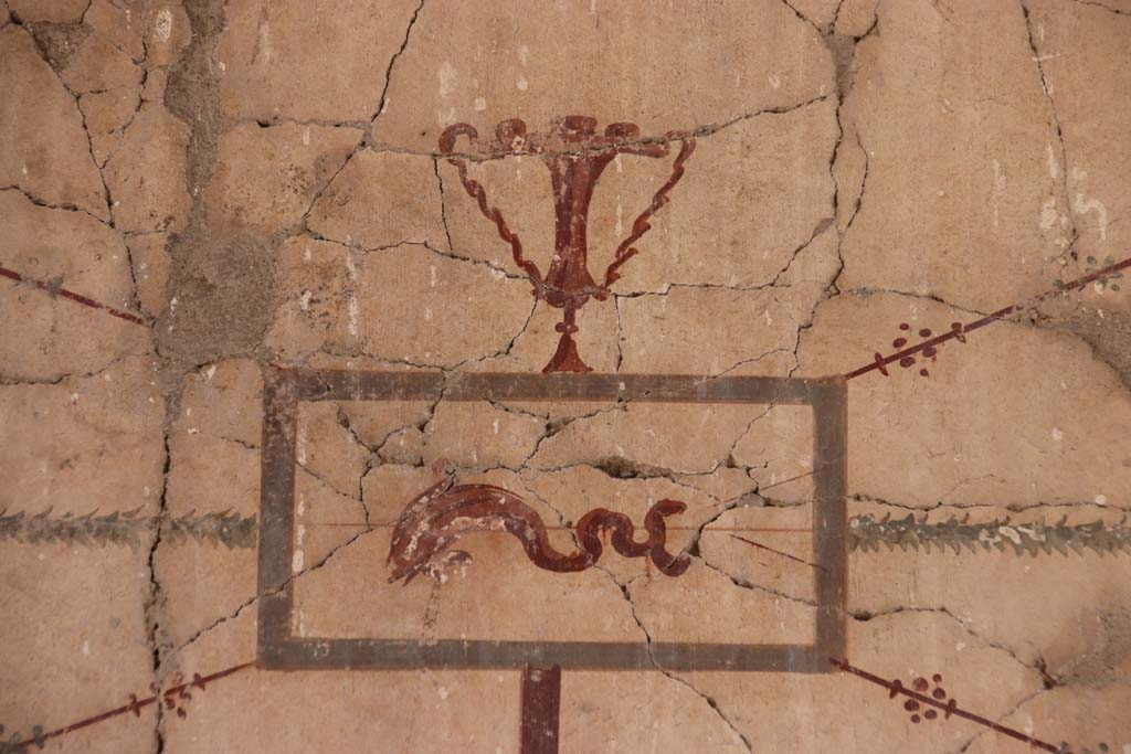 VI.29 Herculaneum. September 2021. 
Tablinum 5, painted panel from upper west (left) end of north wall. Photo courtesy of Klaus Heese.
