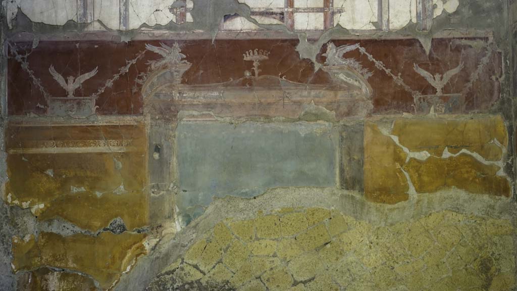 VI.29 Herculaneum. August 2021. Room 7, oecus, detail of painted decoration on north wall. Photo courtesy of Robert Hanson.