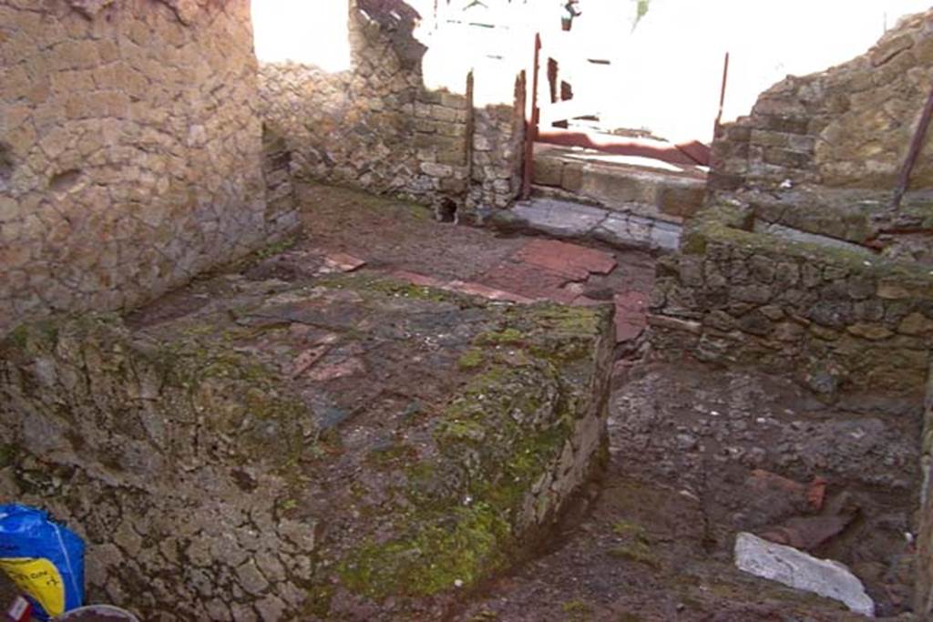 VI.30, Herculaneum. February 2003.  Looking south-west across area, towards entrance doorway and doorway to small room. Photo courtesy of Nicolas Monteix.
