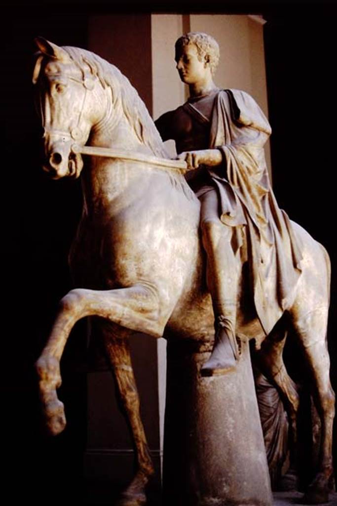 VII.16 Herculaneum. 1978. Statue of younger Nonius Balbus, now in Naples Museum. 
Photo by Stanley A. Jashemski.   
Source: The Wilhelmina and Stanley A. Jashemski archive in the University of Maryland Library, Special Collections (See collection page) and made available under the Creative Commons Attribution-Non Commercial License v.4. See Licence and use details.
J78f0437
According to Kraus, “The head of Balbus [the younger] is a modern copy made by the sculptor Angelo Brunelli (1740-1806) after the original was destroyed in 1799 by a cannonball fired by the revolutionaries attacking the royal villa and museum in Portici.”
See Kraus T. and von Matt L., 1975. Pompeii and Herculaneum: Living cities of the dead. New York: Abrams, (p.125).

According to Wallace-Hadrill, Marcus Nonius Balbus was one of the leading citizens and benefactors of Herculaneum. 
He became a praetor in Rome, and the governor (proconsul) of Crete and Cyrene. 
In the Basilica Noniana, his portrait in the toga of a citizen, is accompanied by that of his father, with the same name, his mother Viciria, probably his wife Volasennia, and possibly his daughters. 
The impression of his face was left in the tufa at the Theatre, from his statue in heroic nudity. 
We see statues of him together with his father, both on horseback from a public square outside the Theatre, with an inscription recalling his benefactions to the town.
Finally, his statue can be found on the terrace by the Suburban Baths, in the armour of a Roman commander.
See Wallace-Hadrill, A. 2011. Herculaneum, Past and Future. London, Frances Lincoln Ltd, (p.130-133 and p. 192).