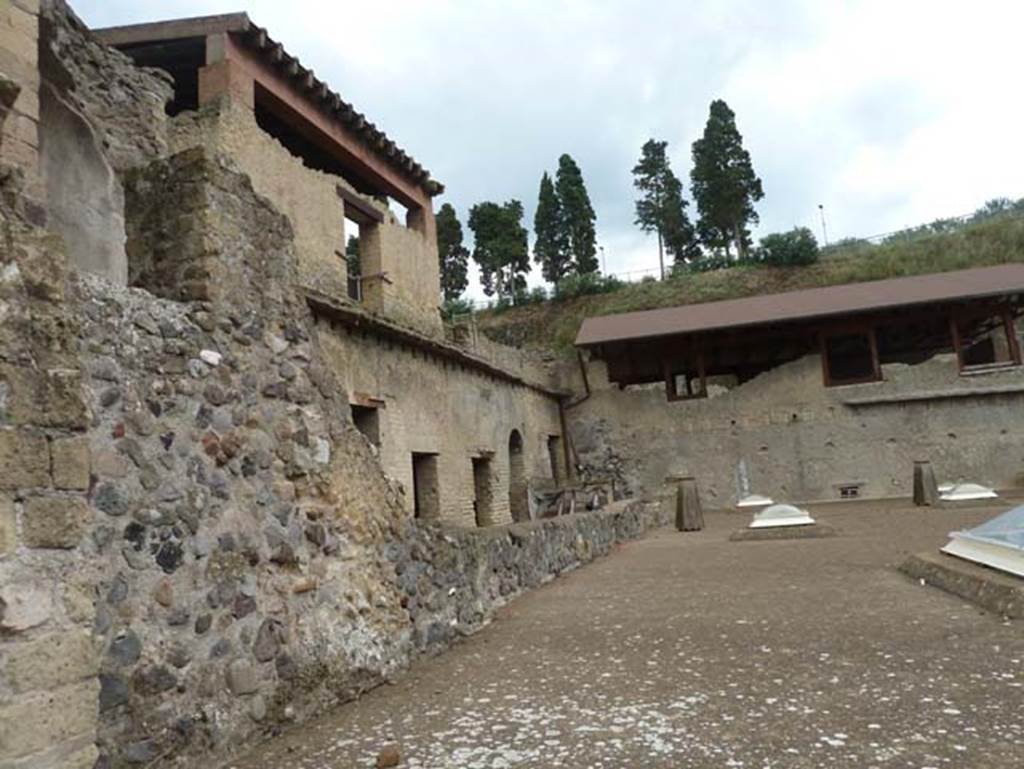 Ins. Orientalis I, 1a, Herculaneum, September 2015. Looking east along roof of Suburban baths.  On the left of it are the lower floor rooms that used to be connected to the House of the Gem, until the stairs were taken away, and it became a separate dwelling. It is known as the House of M. Pilius Primigenius Granianus due to a bronze seal being found in a carbonised wooden box.

