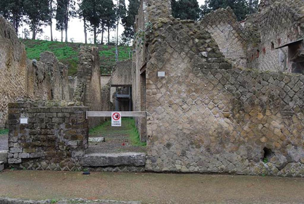 Ins.Or.II.2, Herculaneum, December 2008. Looking east to entrance doorway to long corridor.
The base of the wooden stairs to the upper floor, can be seen on the left of the corridor.
Photo courtesy of Nicolas Monteix. 

