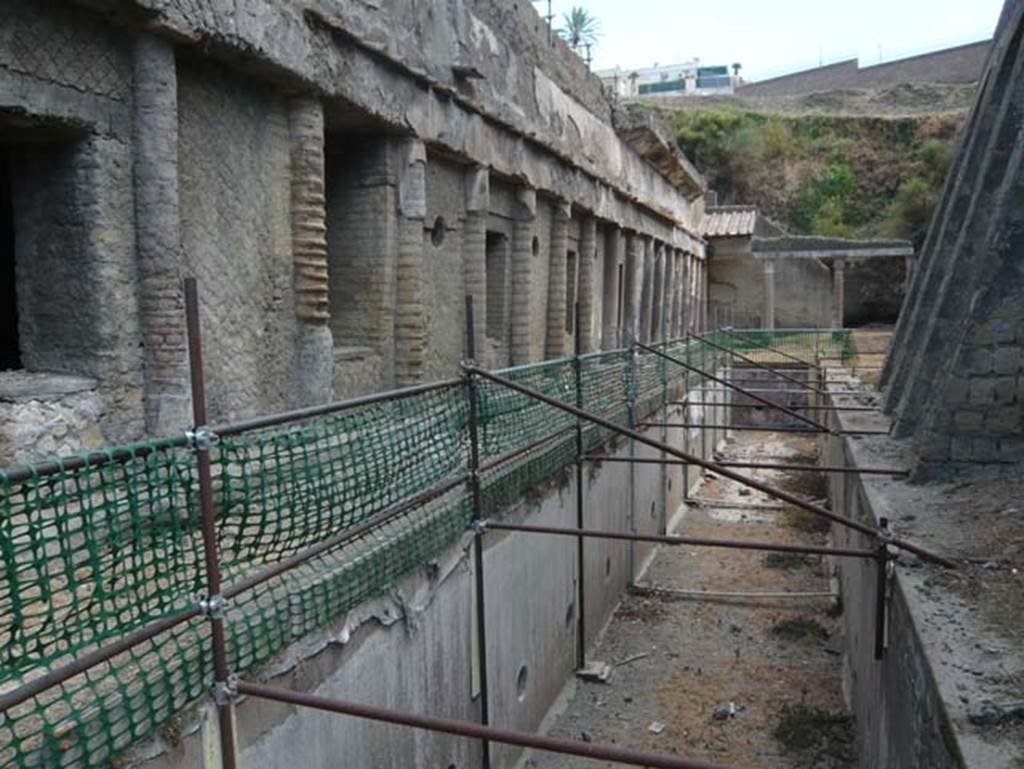 Ins. Orientalis II 4, Herculaneum, August 2013. Looking east along exterior of the windowed gallery, the cryptoporticus. Photo courtesy of Buzz Ferebee.
