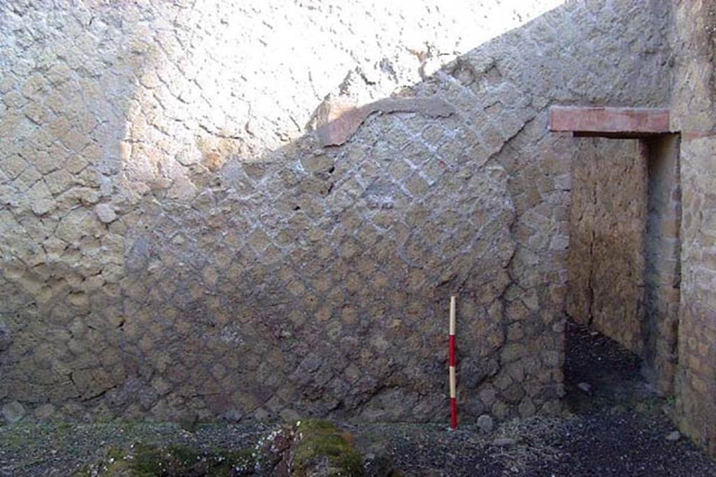 Ins Or II, 11, Herculaneum. January 2002. North wall, east end, with doorway linking to Ins.Or.12. 
Photo courtesy of Nicolas Monteix.
