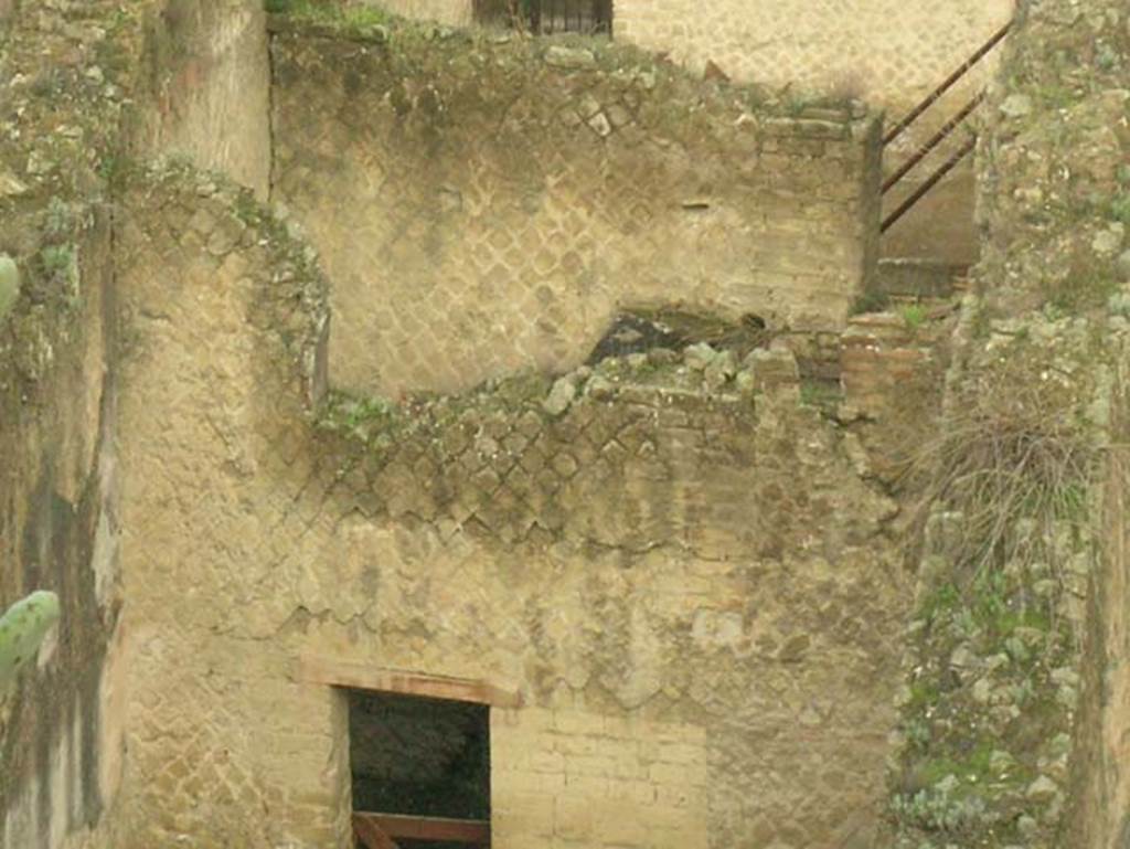 Ins. Orientalis II.11, Herculaneum. December 2004. 
Looking west across rear room towards doorway, and into a room with an upper floor.
Photo courtesy of Nicolas Monteix.
