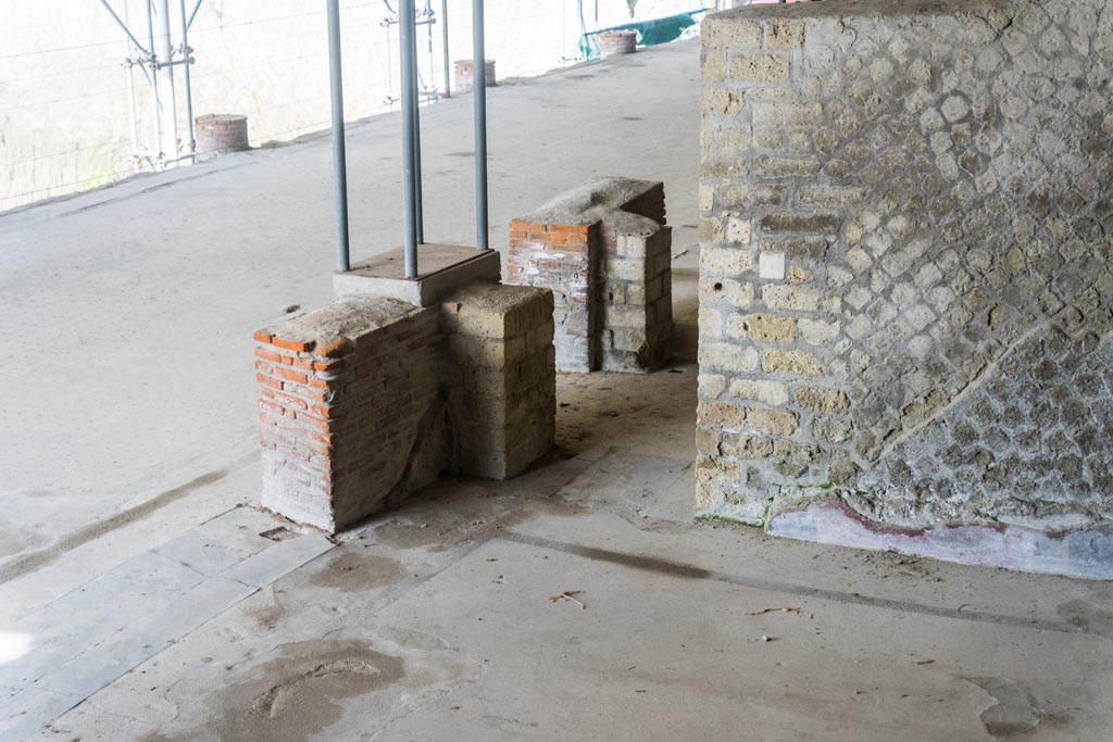 Herculaneum Villa dei Papiri. October 2023. 
Room (i), triclinium, looking south-west towards lower west wall with doorway to corridor (h), in centre. Photo courtesy of Johannes Eber. 

