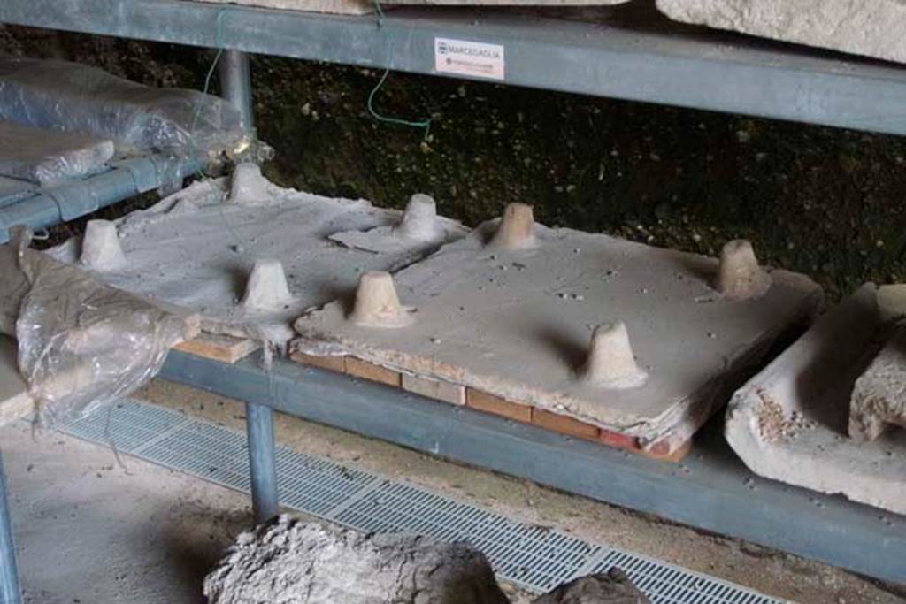 Villa dei Papiri, Herculaneum. July 2010. Remains of Tegulae mammatae in store.
Photo courtesy of Michael Binns.